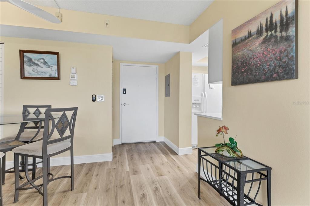 5855 Midnight Pass Road, Unit 420 Sarasota, FL 34242 - Photo 6 of 53 a room with furniture and wooden floor