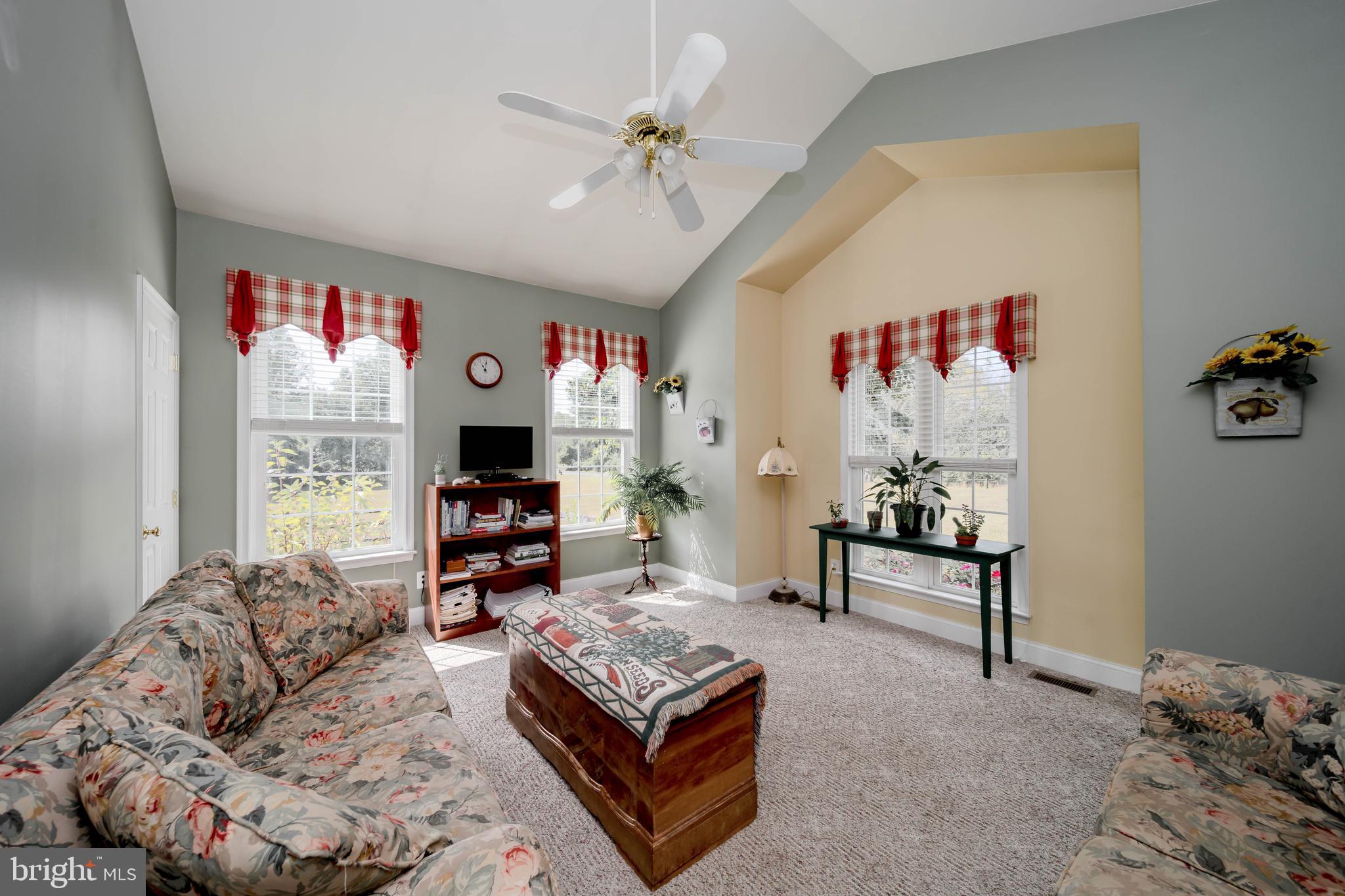 7295 Flint Hill Road Owings, MD 20736 - Photo 15 of 39 a living room with furniture or couch and a flat screen tv