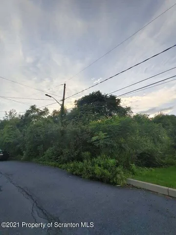 a view of a field with an outdoor space
