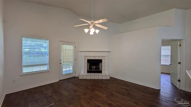 a kitchen with a refrigerator sink stove and cabinets