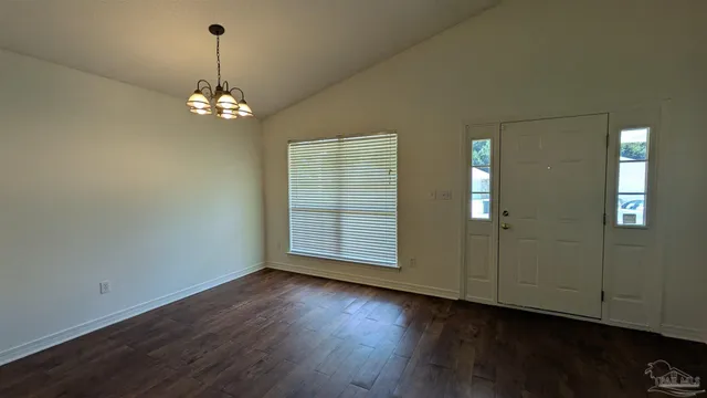 a kitchen with stainless steel appliances a refrigerator and a stove