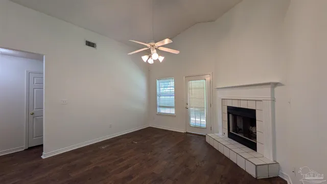 a kitchen with a refrigerator sink stove and cabinets