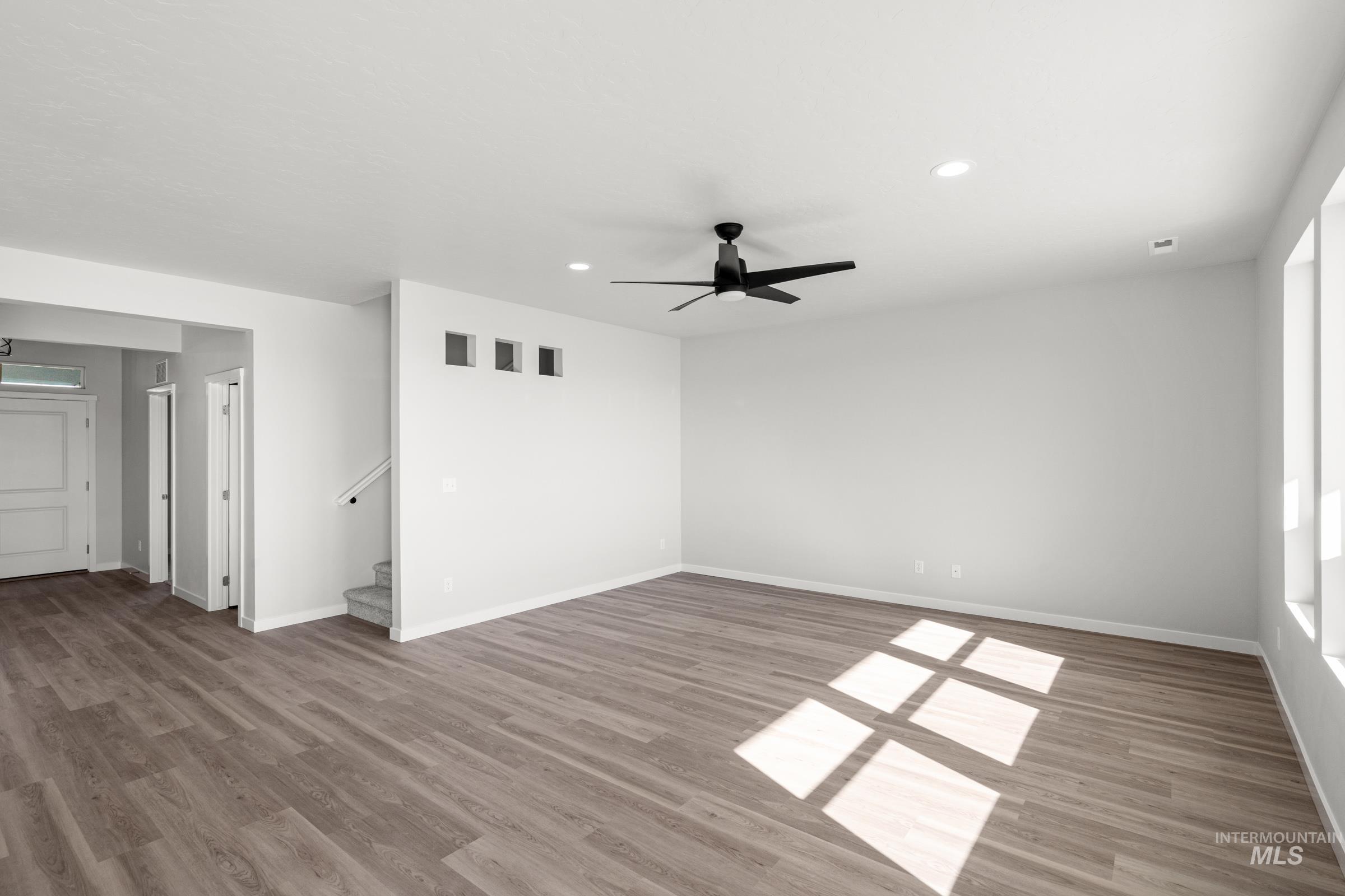 1641 Dyer Street Middleton, ID 83644 - Photo 10 of 28 Unfurnished room featuring ceiling fan, recessed lighting, and light wood-style floors