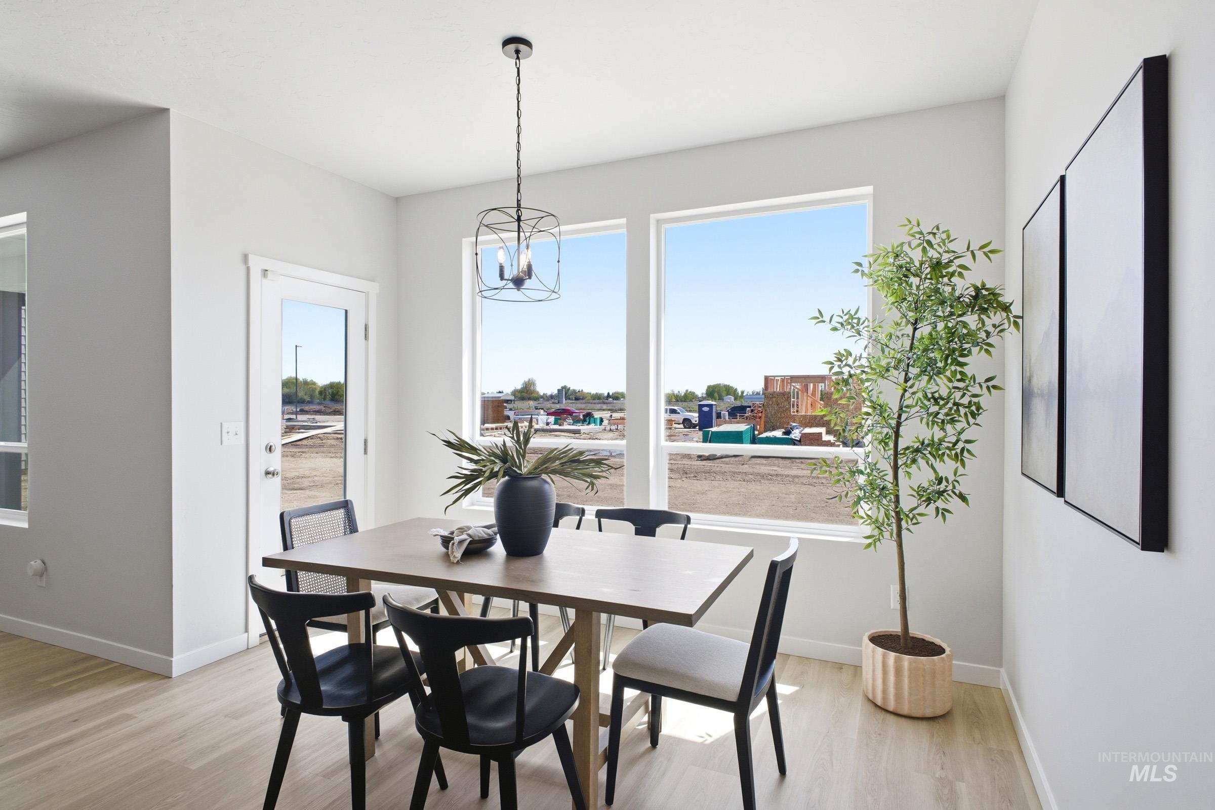 1641 Dyer Street Middleton, ID 83644 - Photo 17 of 29 Dining room featuring light wood-style floors and a chandelier