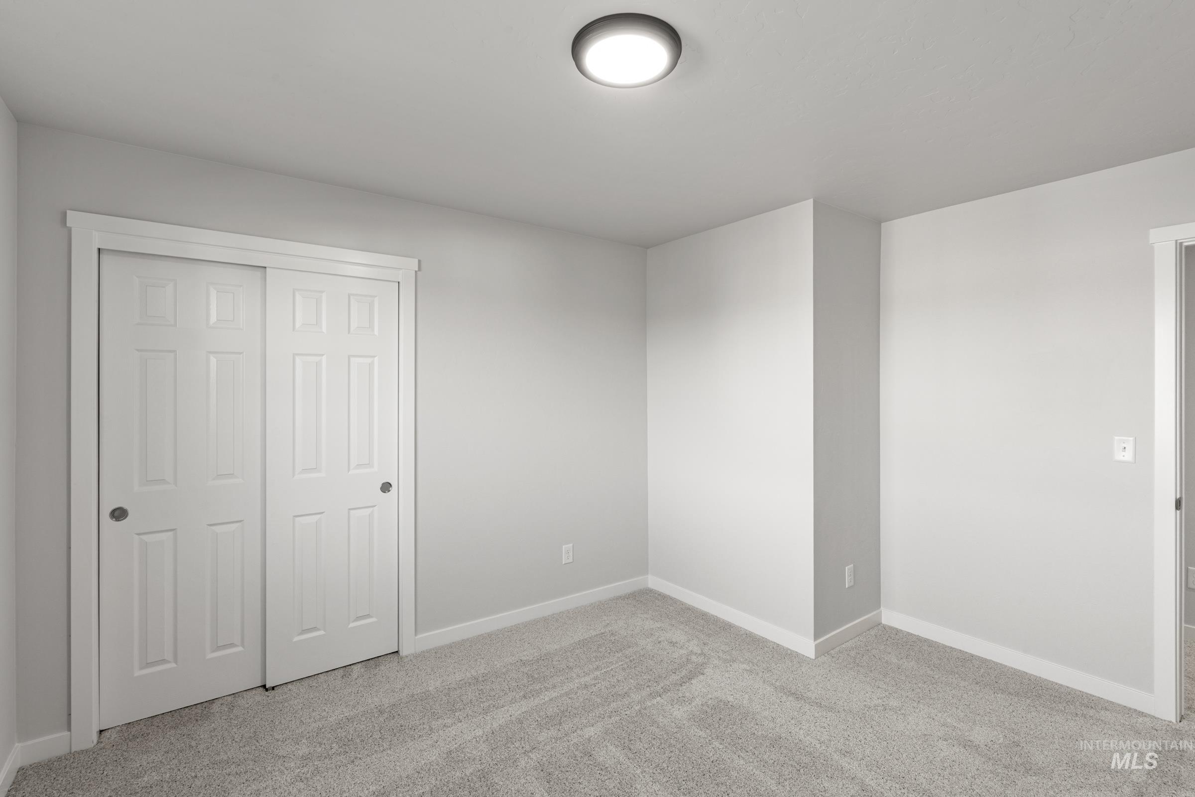 1641 Dyer Street Middleton, ID 83644 - Photo 17 of 28 Unfurnished bedroom with light carpet and a closet