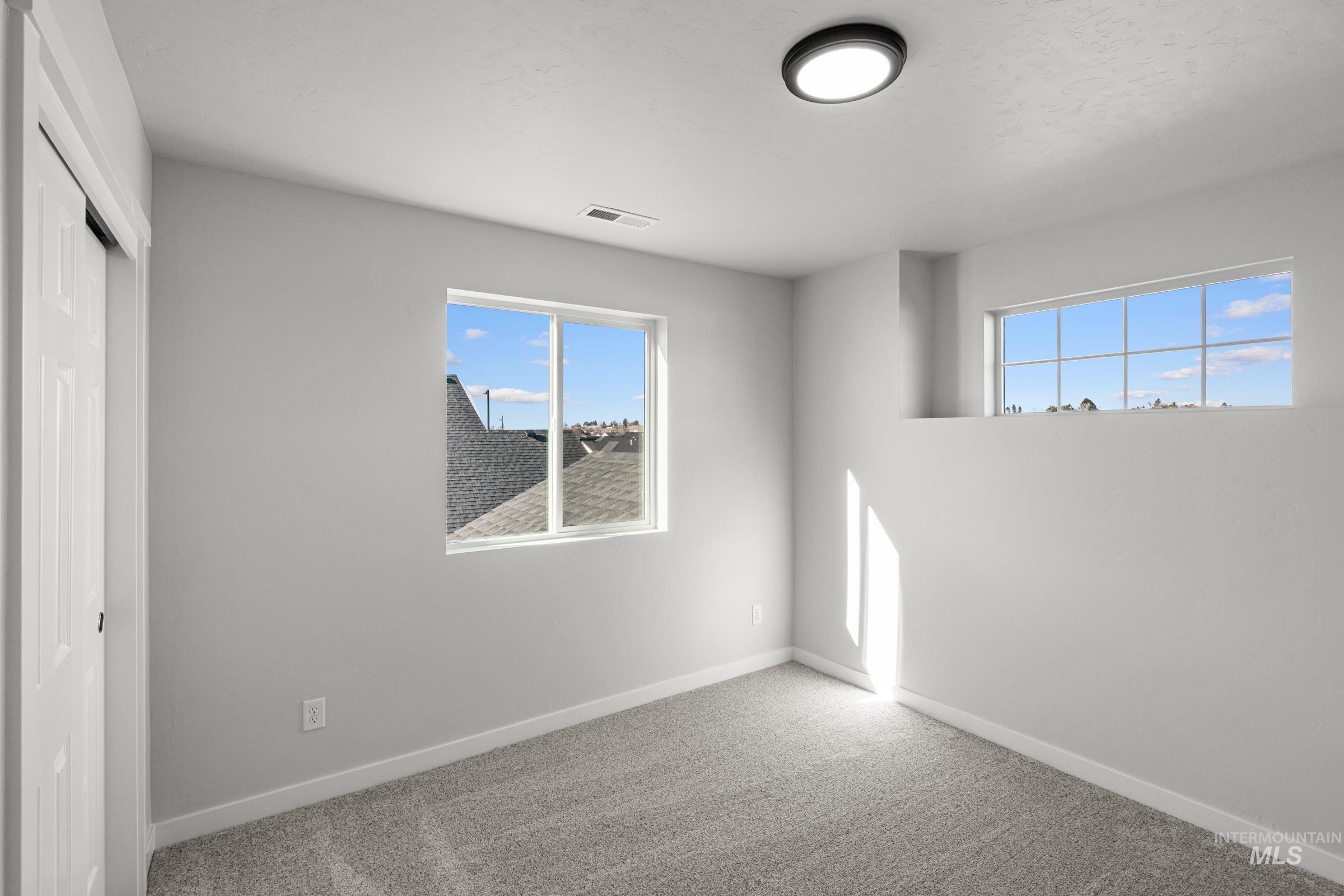 1641 Dyer Street Middleton, ID 83644 - Photo 18 of 28 Unfurnished bedroom with a closet and carpet floors