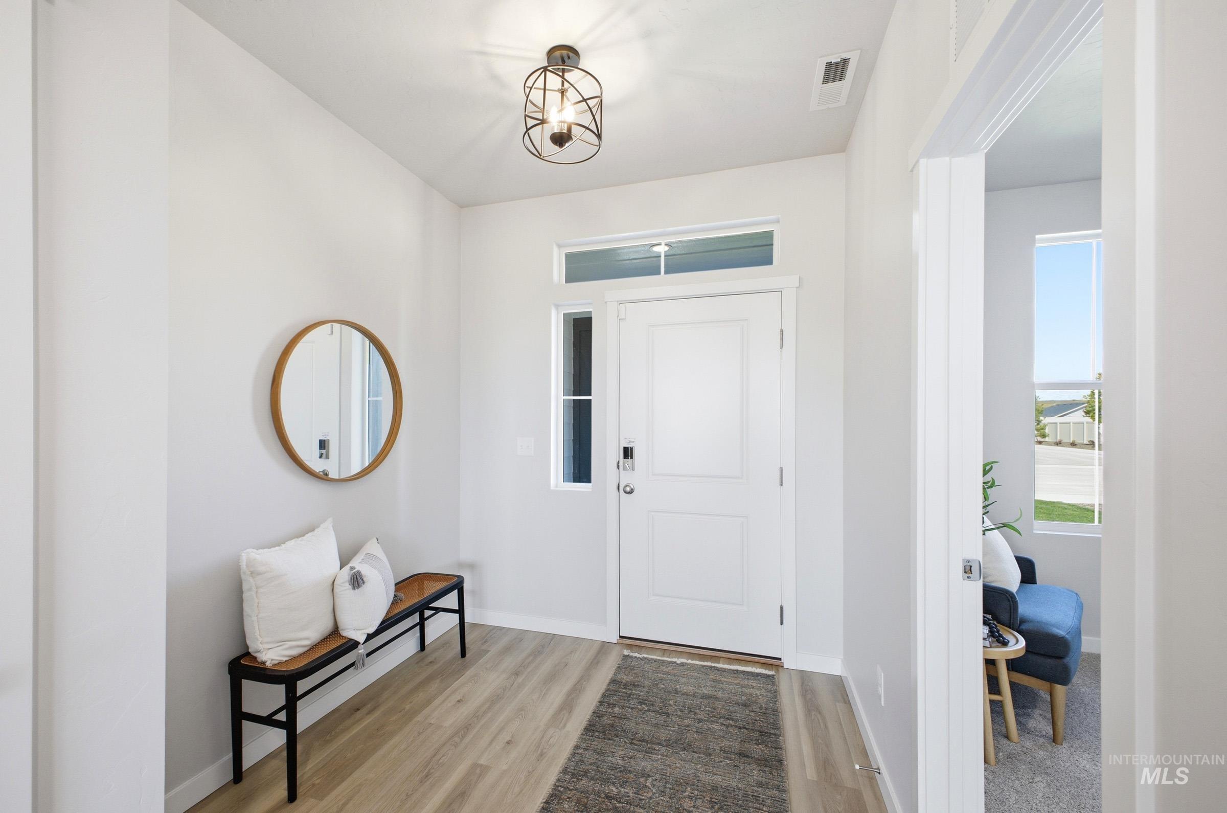 1641 Dyer Street Middleton, ID 83644 - Photo 2 of 29 Foyer featuring light wood-style floors and baseboards