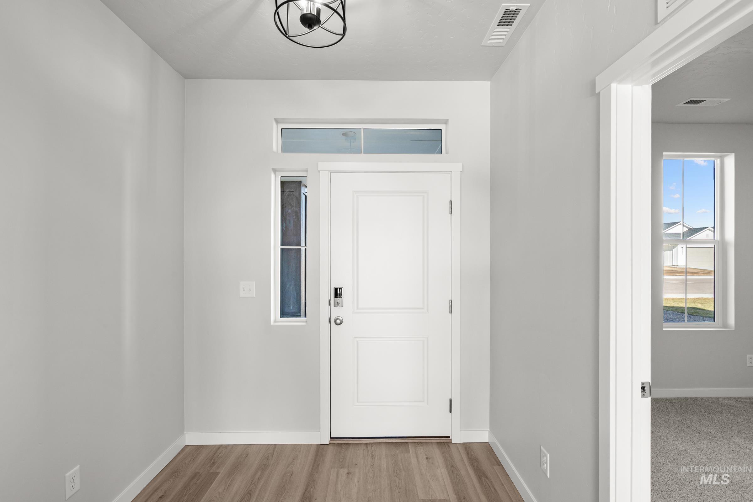 1641 Dyer Street Middleton, ID 83644 - Photo 3 of 28 Foyer entrance featuring baseboards and light wood-style flooring