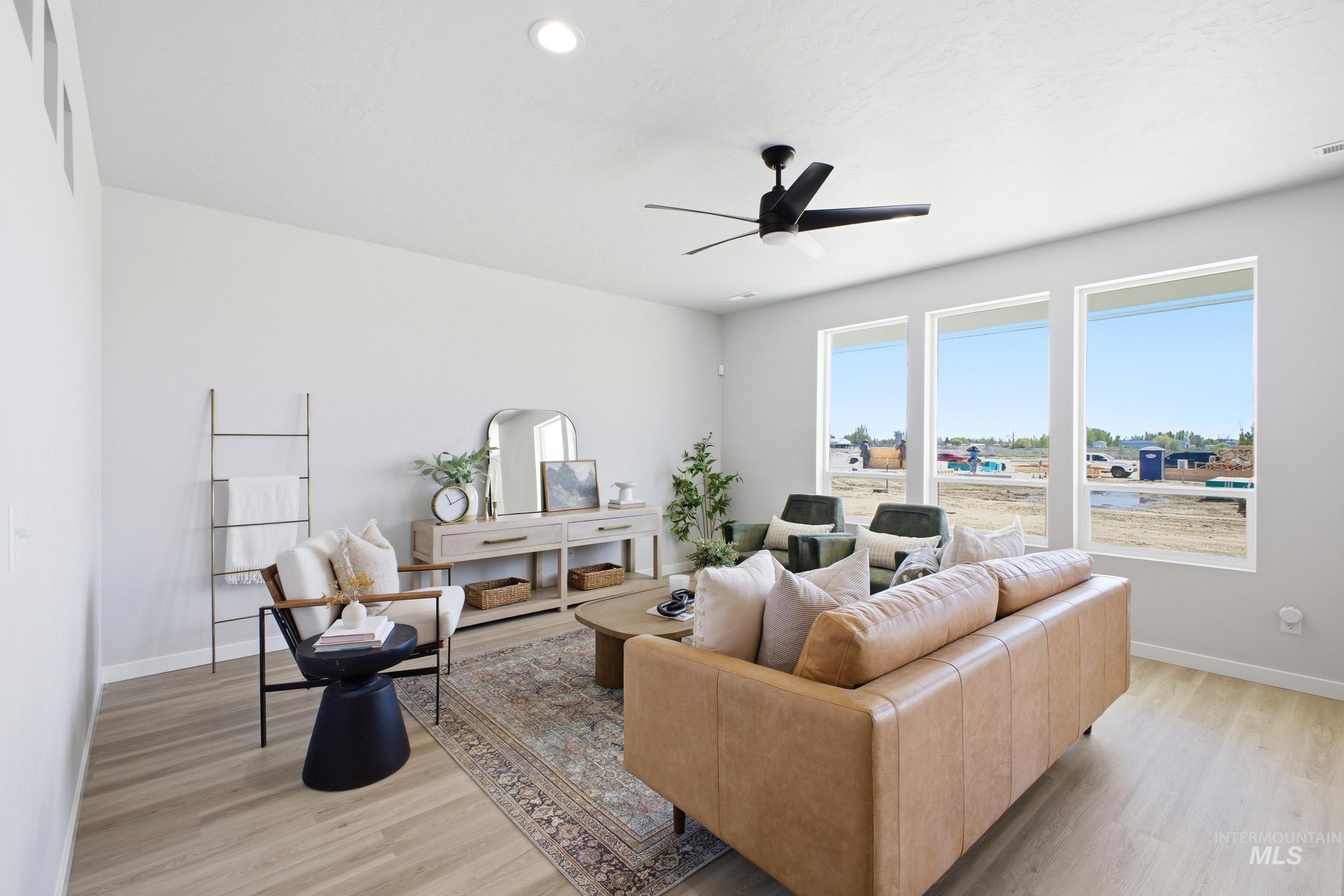 1641 Dyer Street Middleton, ID 83644 - Photo 5 of 29 Living room with ceiling fan, light wood finished floors, and recessed lighting