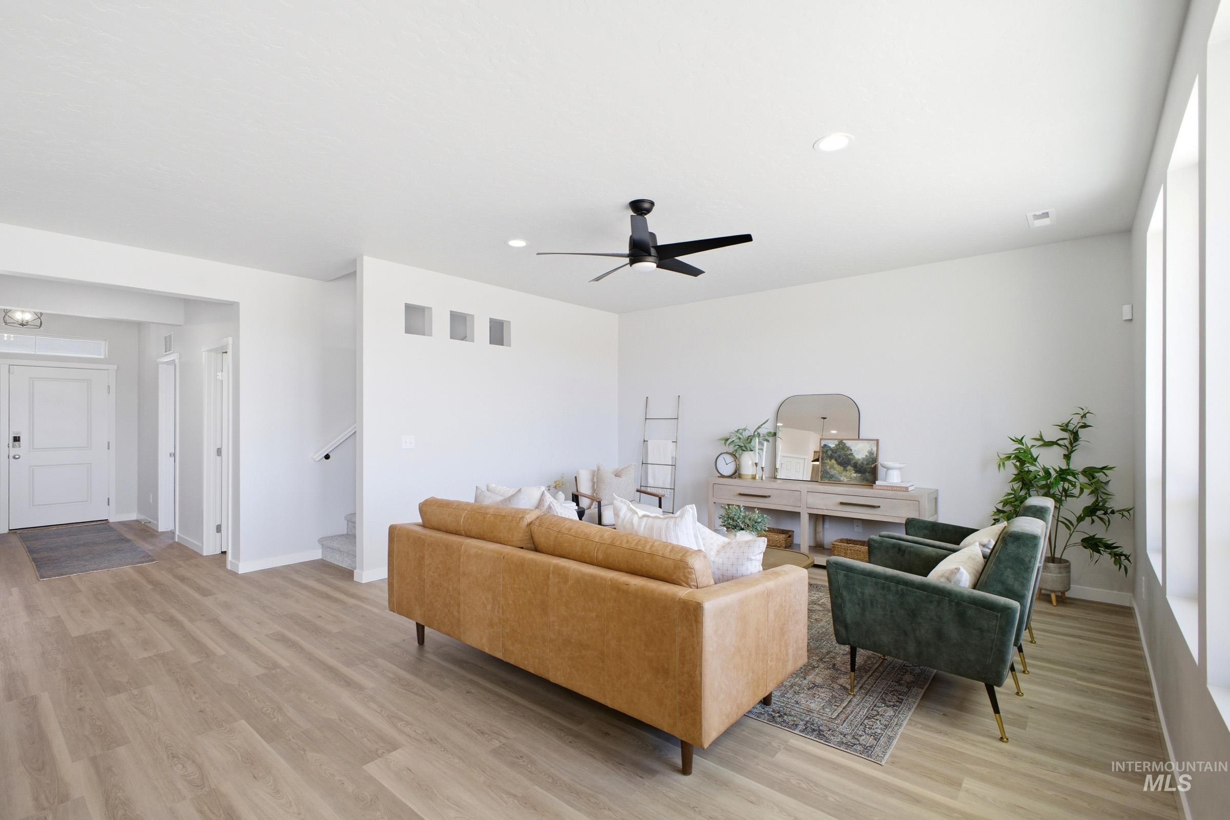 1641 Dyer Street Middleton, ID 83644 - Photo 8 of 29 Living area featuring light wood-style flooring, a ceiling fan, and recessed lighting