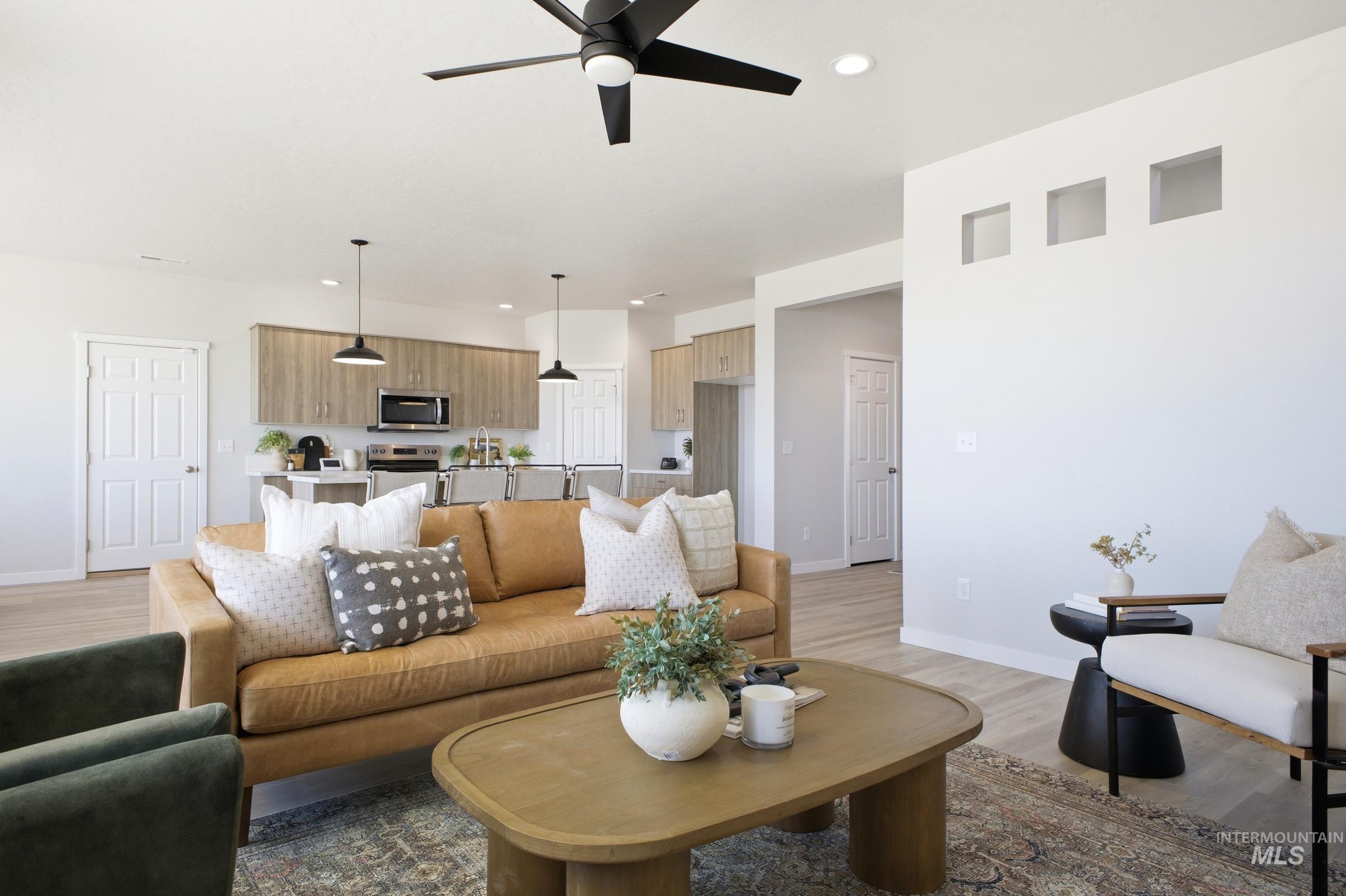 1641 Dyer Street Middleton, ID 83644 - Photo 10 of 29 Living area with light wood-style floors, a ceiling fan, and recessed lighting