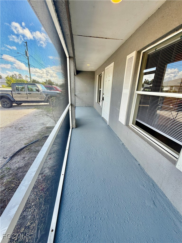 4739 28th Street Southwest Lehigh Acres, FL 33973 - Photo 4 of 14 a view of a living room with a balcony