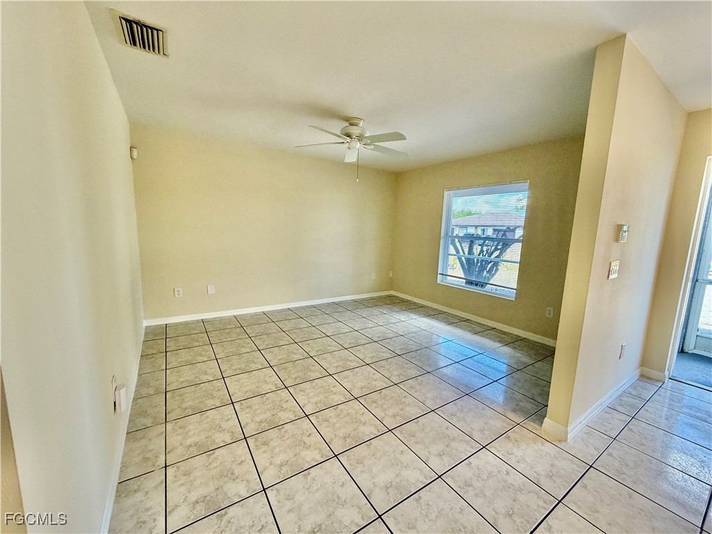 4739 28th Street Southwest Lehigh Acres, FL 33973 - Photo 6 of 14 a view of an empty room and window