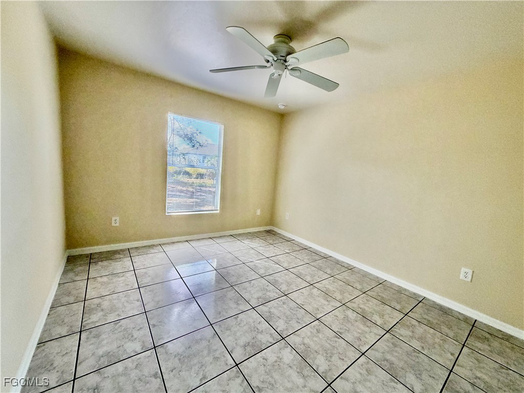 4739 28th Street Southwest Lehigh Acres, FL 33973 - Photo 10 of 14 a view of an empty room and a window