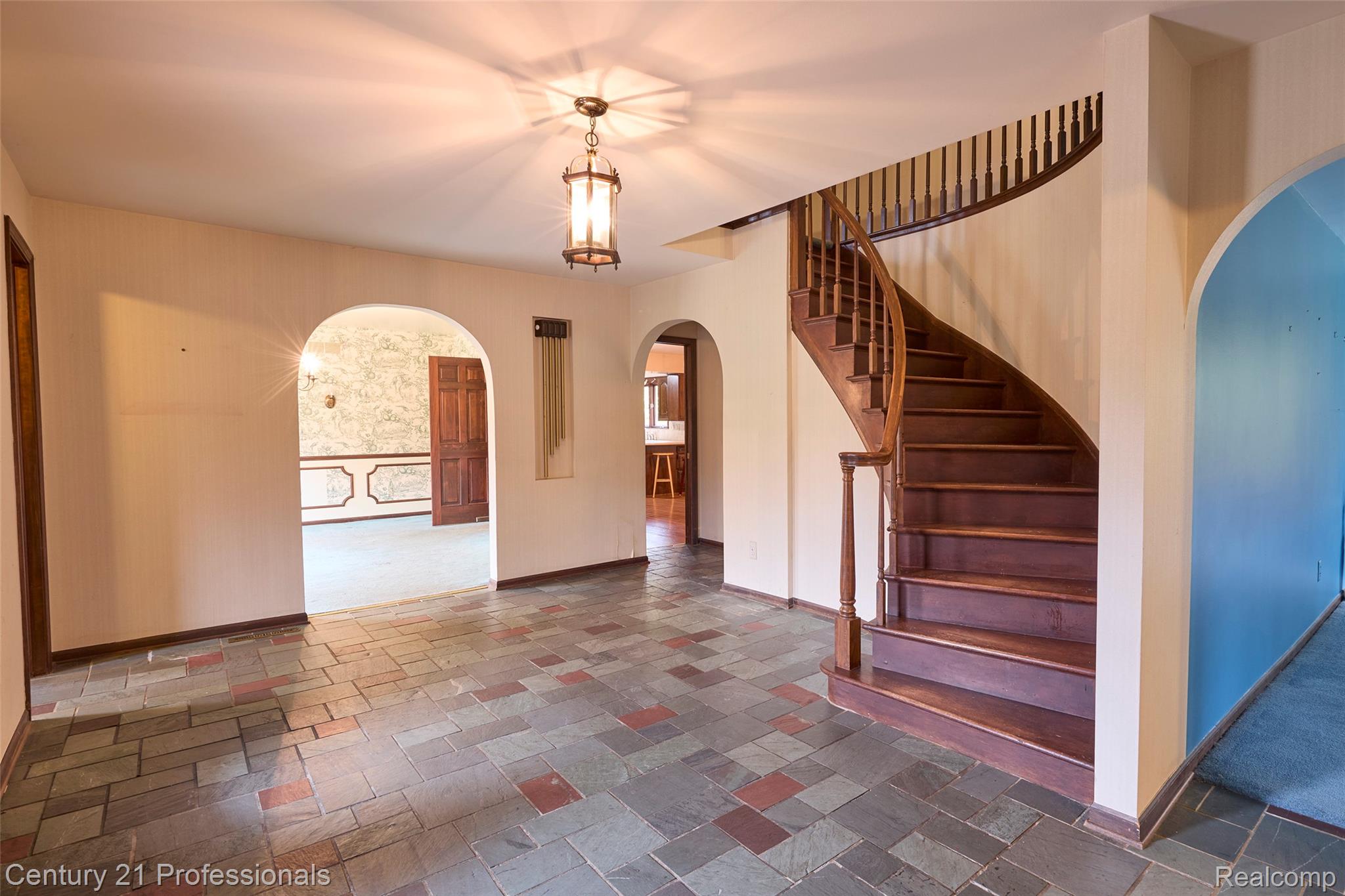 303 East Snell Road Rochester, MI 48306 - Photo 8 of 45 Foyer featuring slate flooring and arched walkways