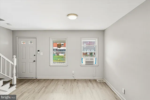 a kitchen with a refrigerator and a stove