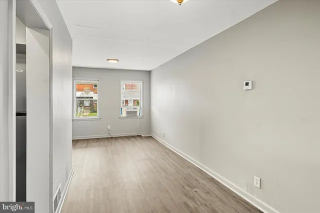 a kitchen with stainless steel appliances granite countertop a refrigerator and a stove