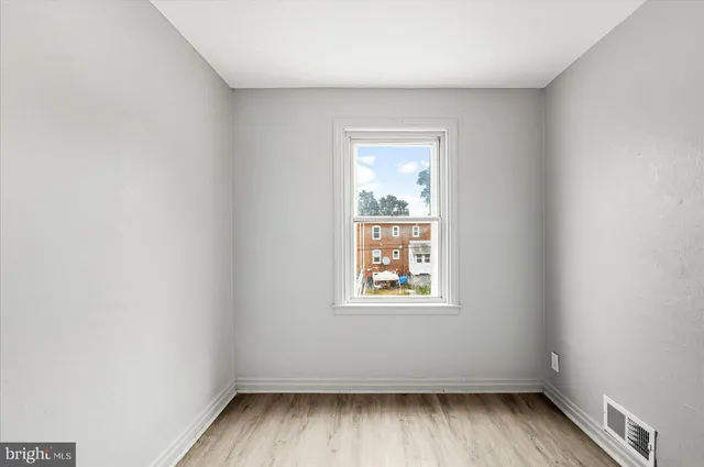 a view of a bathroom from a hallway