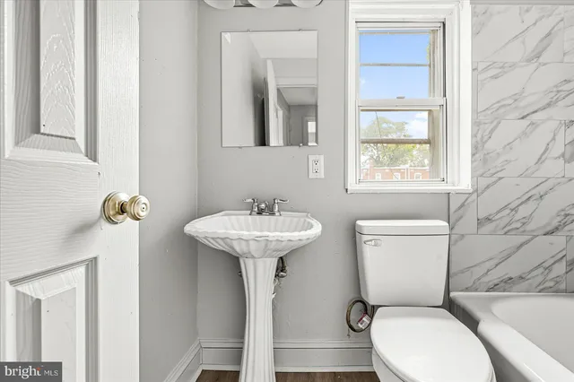 a view of storage and utility room with stairs