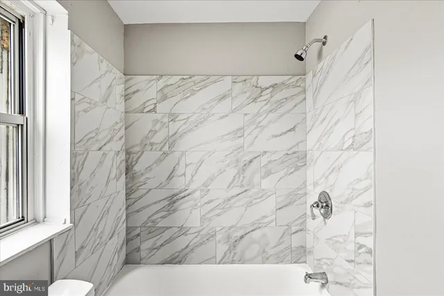 a view of a storage & utility room with washer and dryer