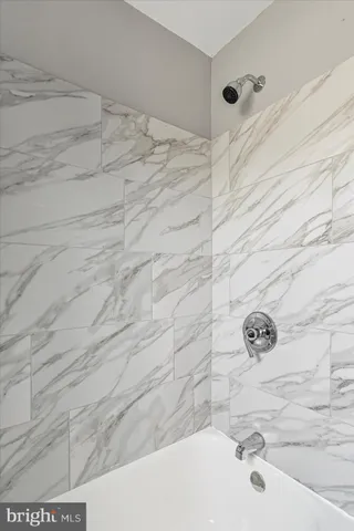 a view of a porch with furniture and garden