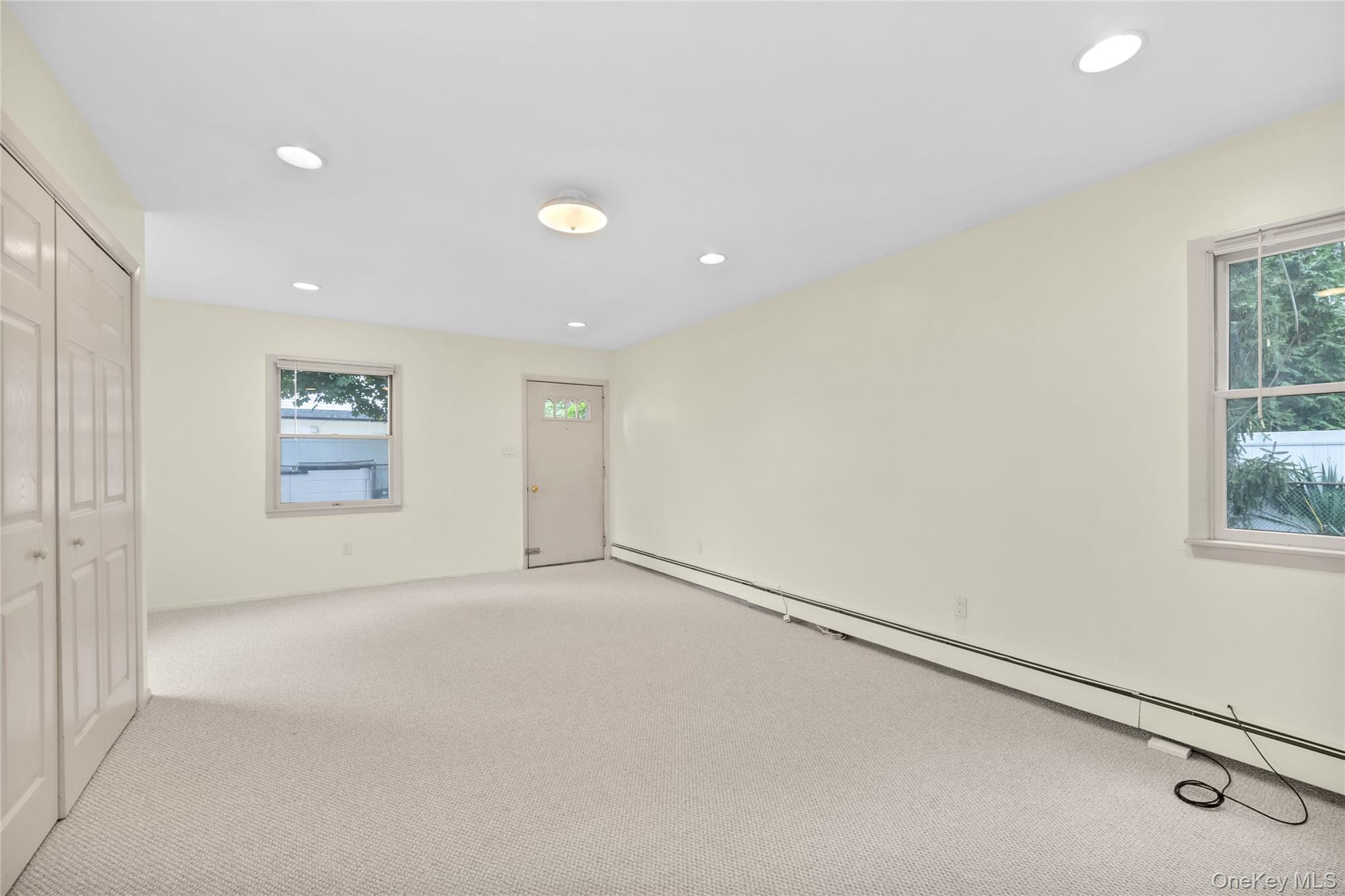 253 Raff Avenue Carle Place, NY 11514 - Photo 7 of 20 a view of an empty room with a window