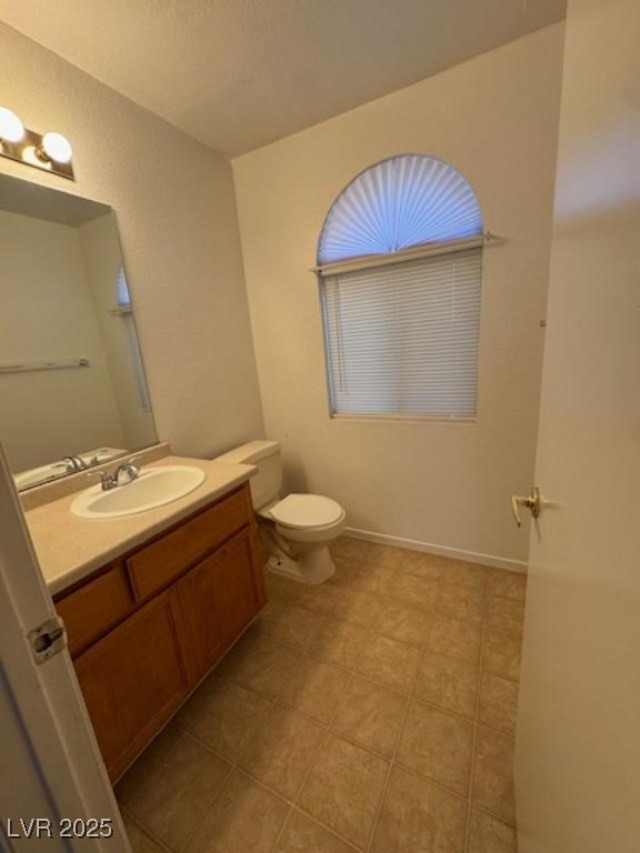 713 Rusty Spur Drive Henderson, NV 89014 - Photo 8 of 15 Bathroom featuring vanity and toilet