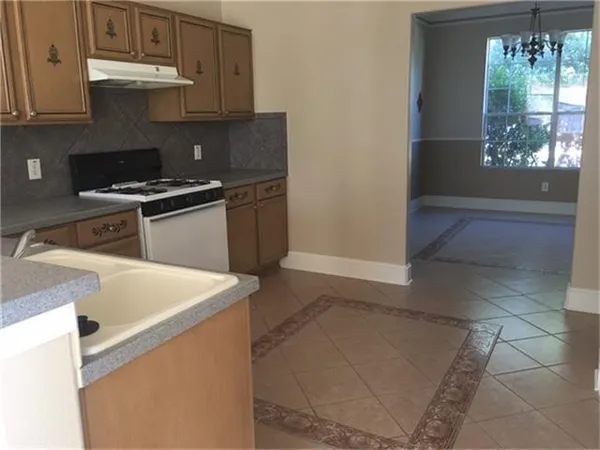 a kitchen that has a sink and a stove