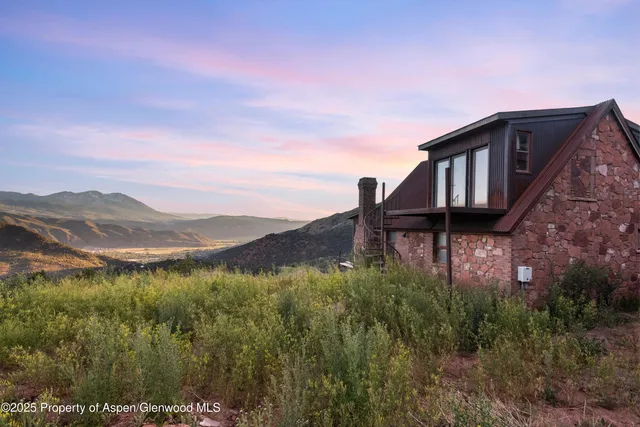 a view of a house with a mountain