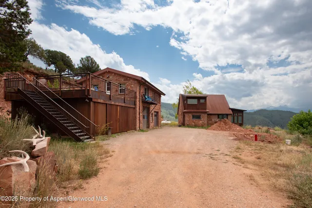a view of a house with a snow in the yard