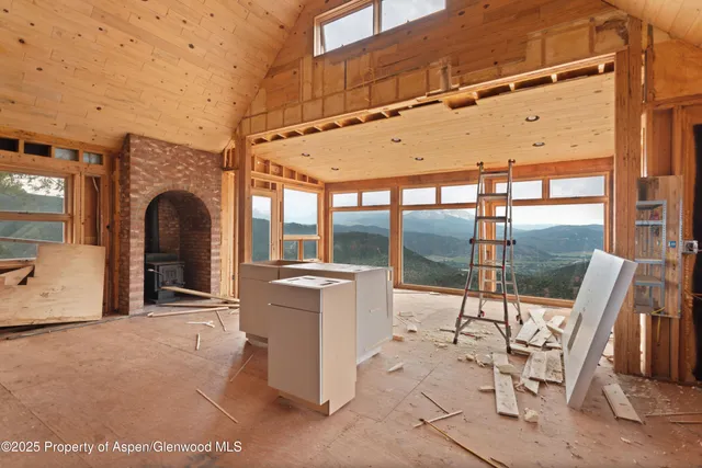 a view of a chairs and table in the patio