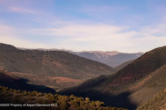 a view of a city with mountain