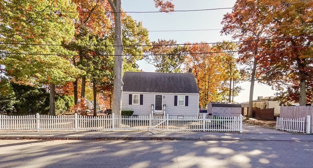 5 Oliver Street Randolph, MA 02368 - Photo 2 of 29 a view of a house with a small yard and wooden fence