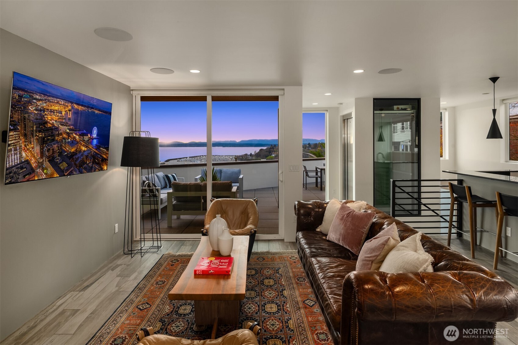 1400 Olympic Way West Seattle, WA 98119 - Photo 18 of 40 a living room with furniture a rug and a flat screen tv