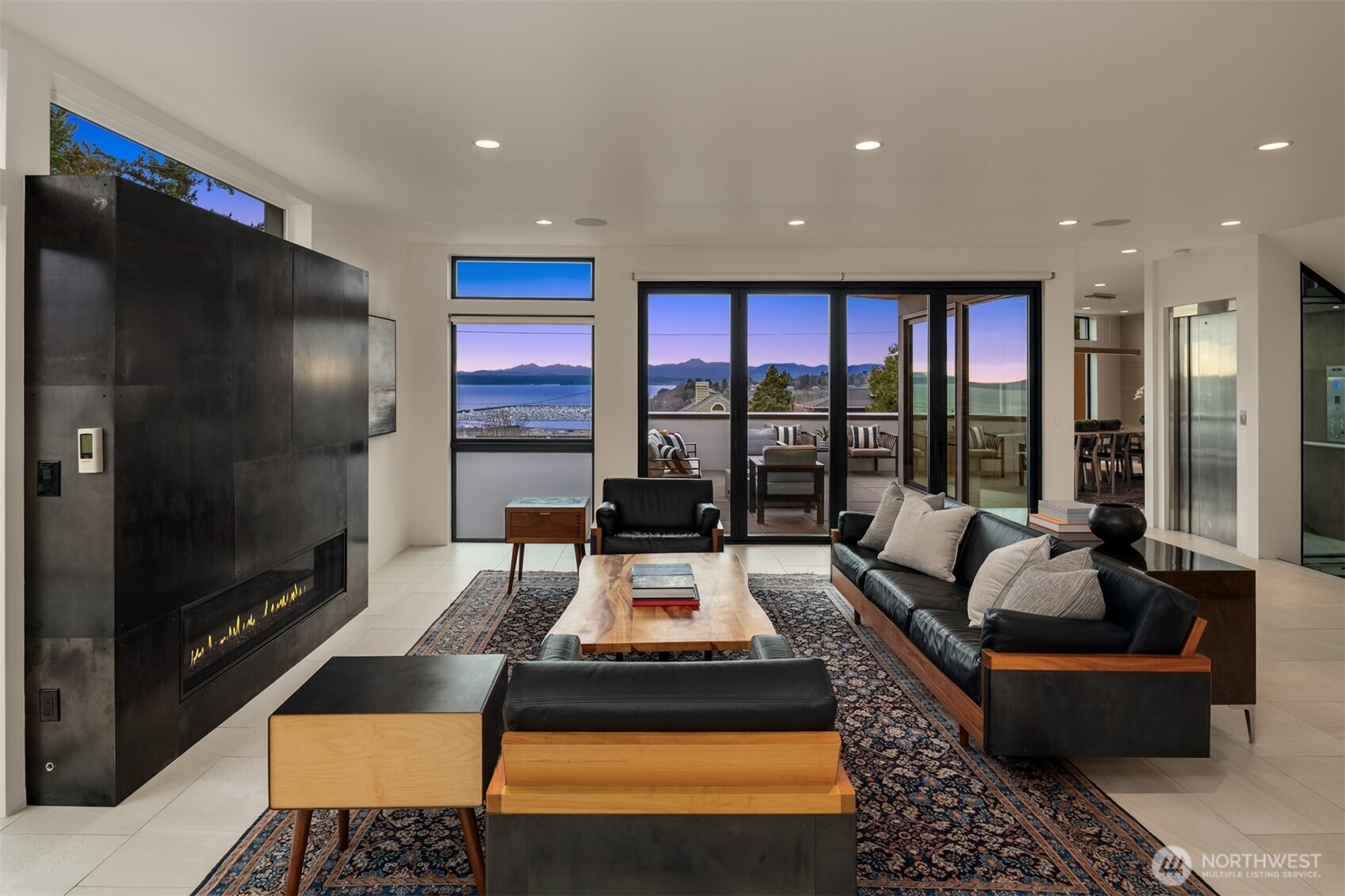 1400 Olympic Way West Seattle, WA 98119 - Photo 2 of 40 a living room with furniture fireplace and flat screen tv