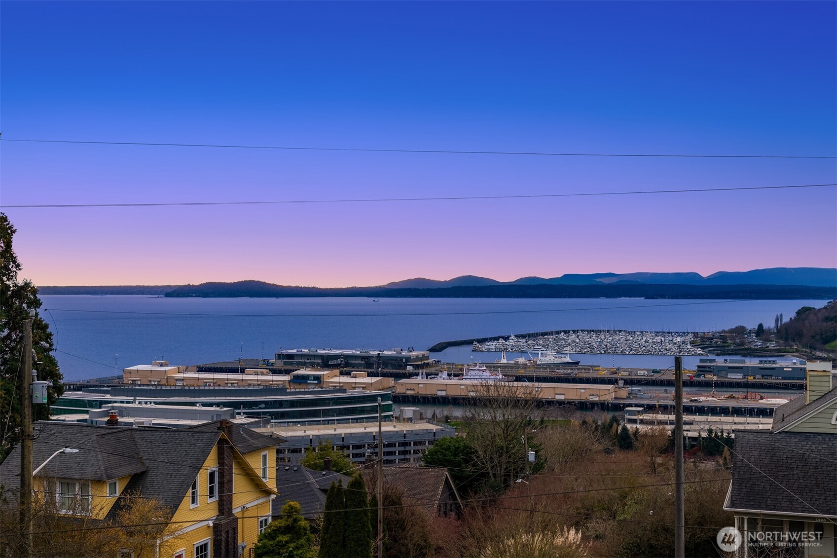 1400 Olympic Way West Seattle, WA 98119 - Photo 21 of 40 a view of a lake with a mountain in the background