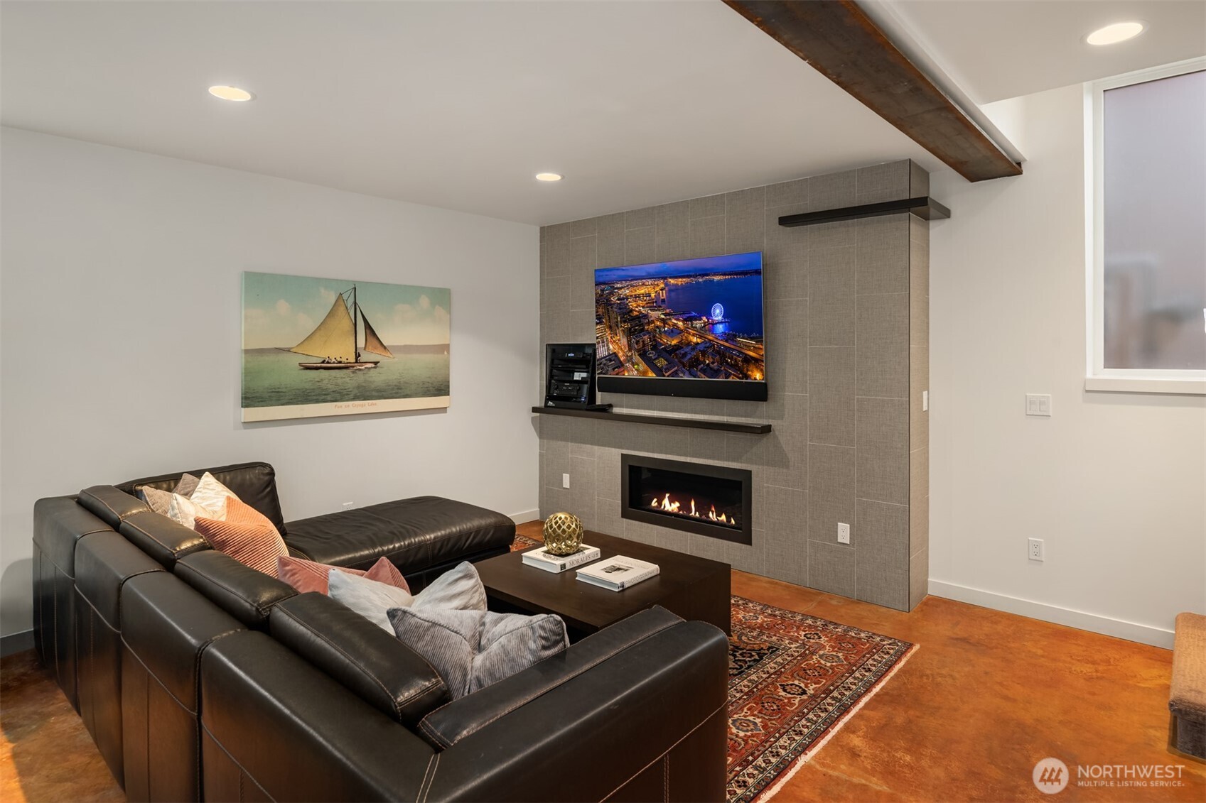 1400 Olympic Way West Seattle, WA 98119 - Photo 29 of 40 a living room with furniture and a flat screen tv