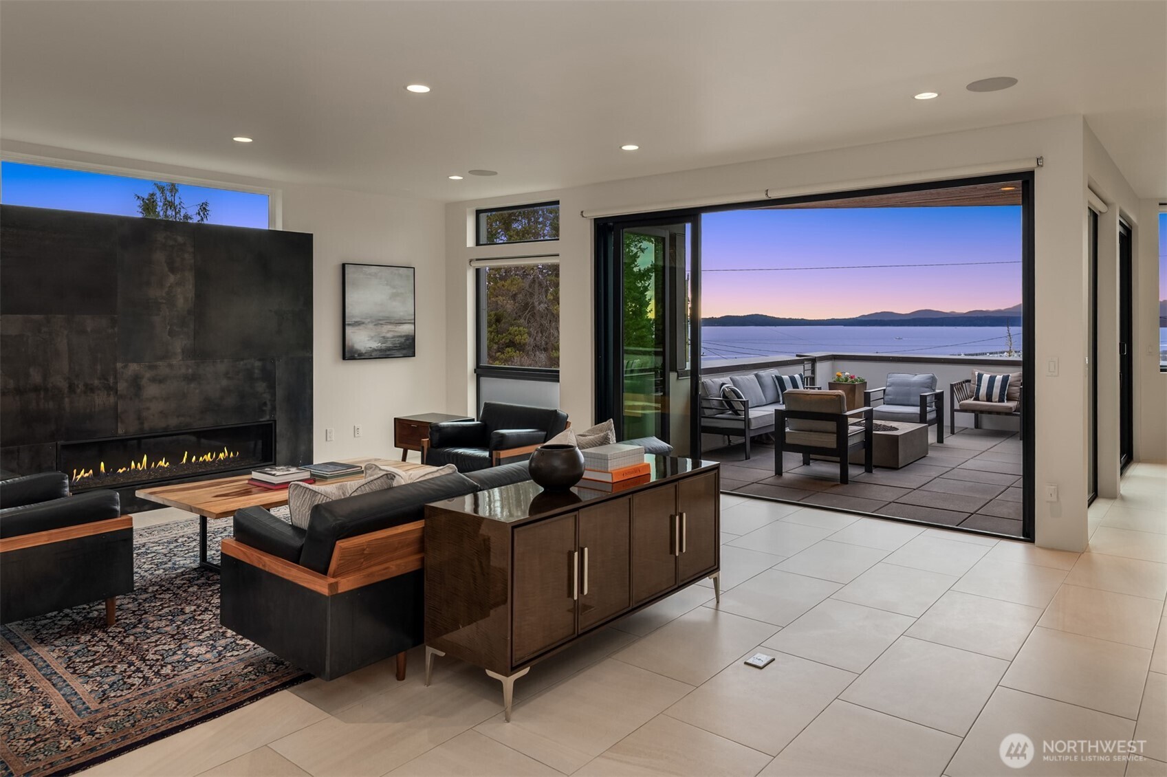 1400 Olympic Way West Seattle, WA 98119 - Photo 3 of 40 a living room with furniture a rug and a flat screen tv