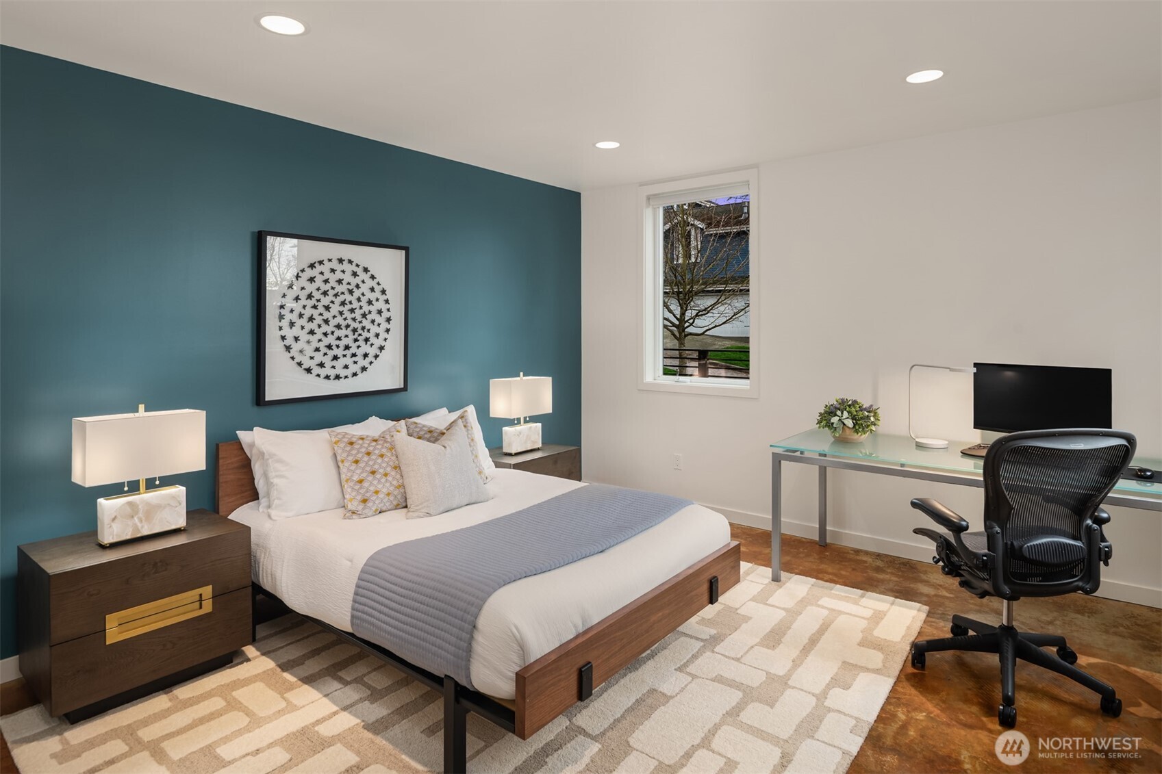 1400 Olympic Way West Seattle, WA 98119 - Photo 32 of 40 a bedroom with a bed and a computer on a table