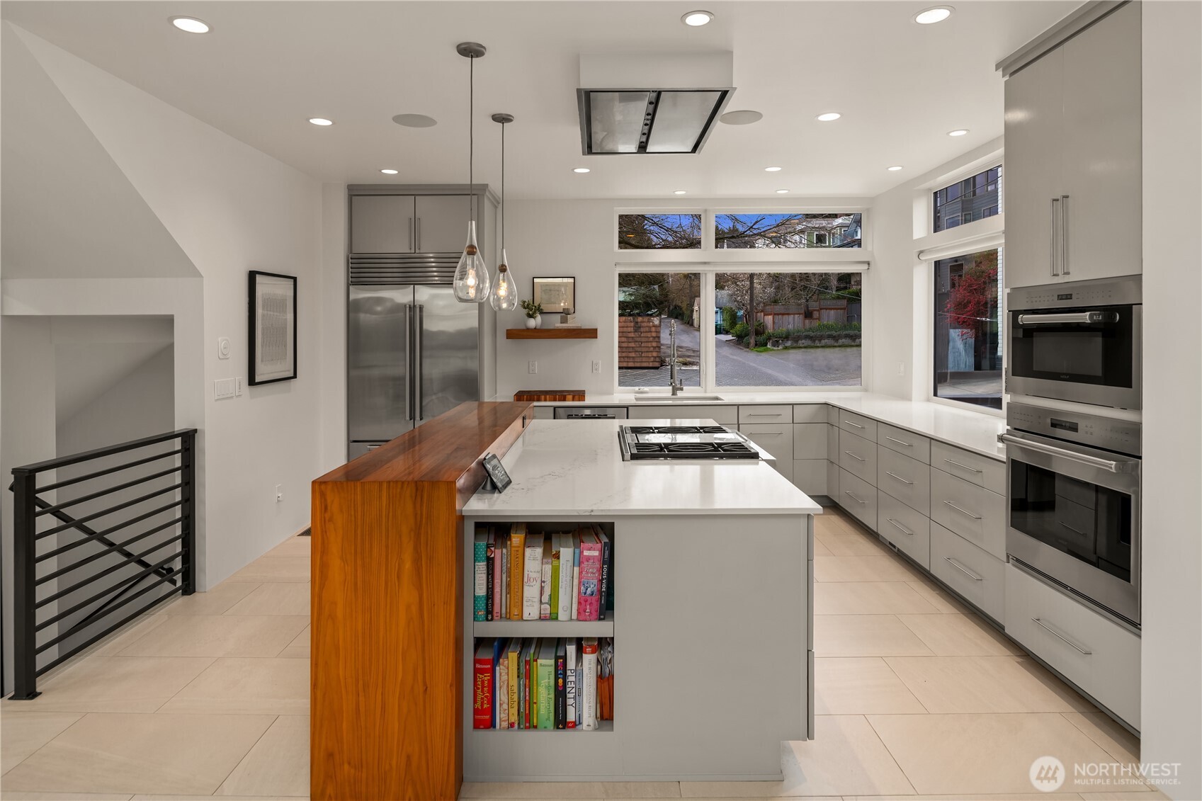 1400 Olympic Way West Seattle, WA 98119 - Photo 6 of 40 a kitchen with stainless steel appliances granite countertop a stove and a refrigerator