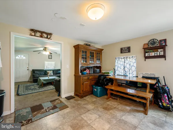 a bedroom with furniture and a flat screen tv