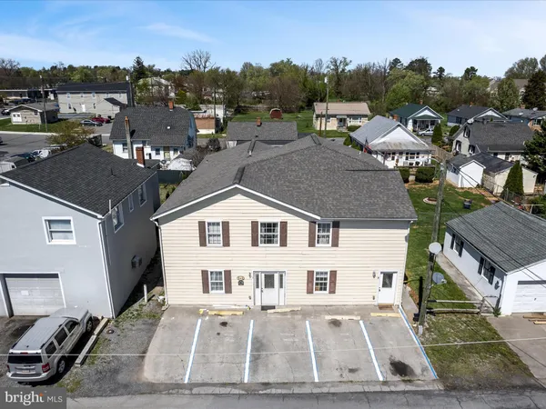 a aerial view of a house with swimming pool
