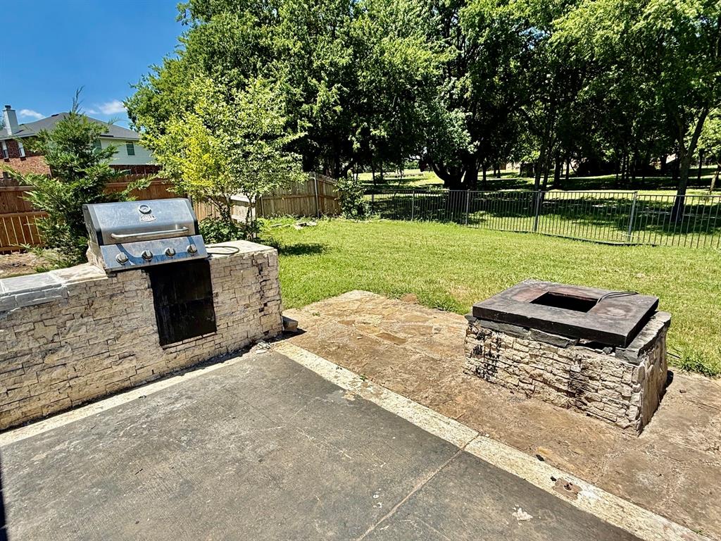 1144 Switchgrass Lane Crowley, TX 76036 - Photo 13 of 17 a view of a garden with an outdoor space