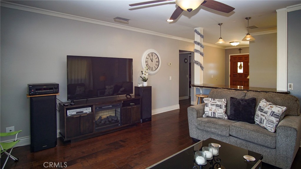 911 East Evergreen Avenue Santa Maria, CA 93454 - Photo 11 of 48 a living room with furniture and a flat screen tv