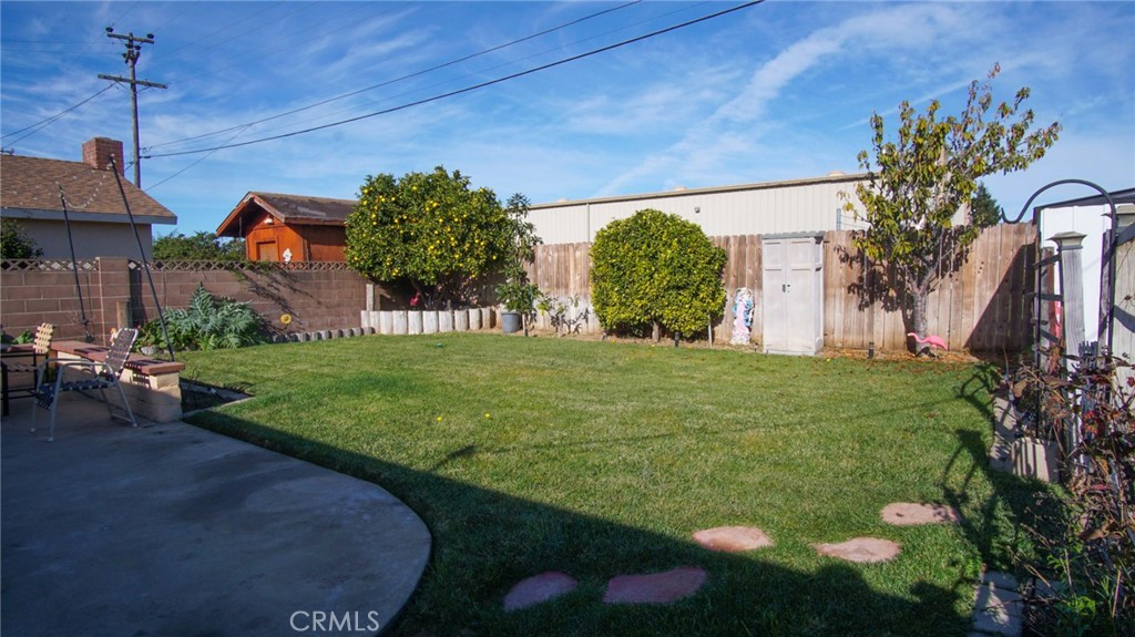 911 East Evergreen Avenue Santa Maria, CA 93454 - Photo 16 of 48 a backyard of a house with lots of green space
