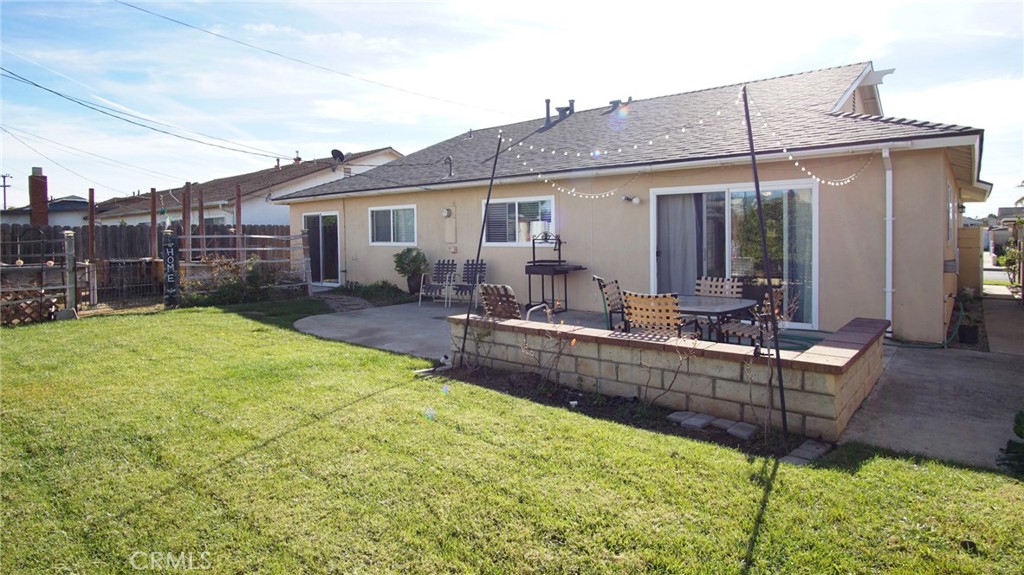 911 East Evergreen Avenue Santa Maria, CA 93454 - Photo 17 of 48 a view of a house with backyard and sitting area
