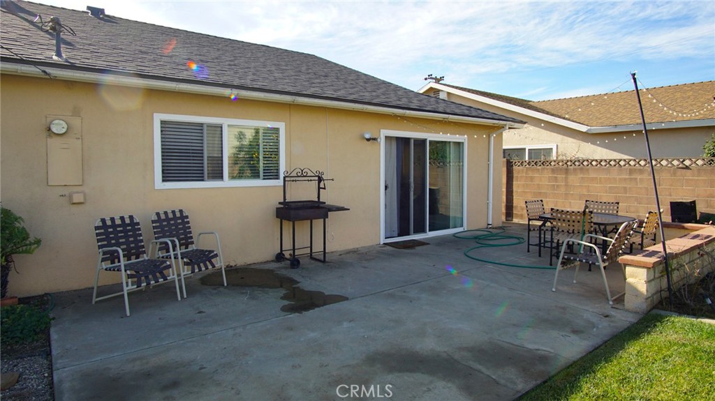 911 East Evergreen Avenue Santa Maria, CA 93454 - Photo 20 of 48 a view of a patio with table and chairs and potted plants