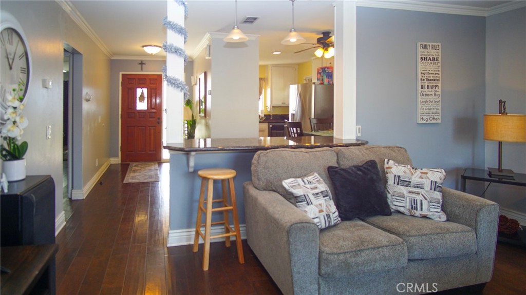 911 East Evergreen Avenue Santa Maria, CA 93454 - Photo 21 of 48 a living room with furniture and a chandelier