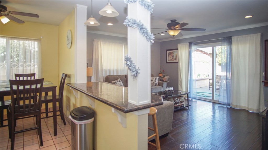911 East Evergreen Avenue Santa Maria, CA 93454 - Photo 22 of 48 a view of a dining room with furniture and wooden floor