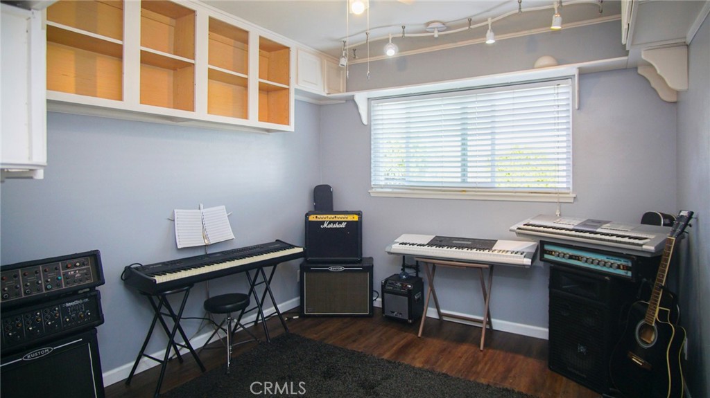 911 East Evergreen Avenue Santa Maria, CA 93454 - Photo 30 of 48 a view of a workspace with furniture and a window